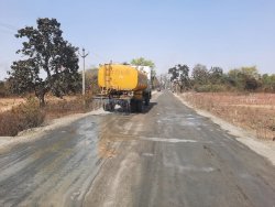 Water sprinkling on road to avoid air pollution